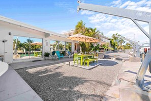 Relax and unwind on our charming patio! With cozy tables and chairs under the shade of trees, it's the perfect spot for enjoying your morning coffee or sharing stories with friends. Come make unforgettable memories in this serene outdoor oasis!