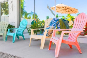 Enjoy your next getaway surrounded by vibrant colors and cozy chairs! Perfect for lounging, reading, or sipping a refreshing drink while soaking up the sun. Your ideal outdoor retreat awaits!