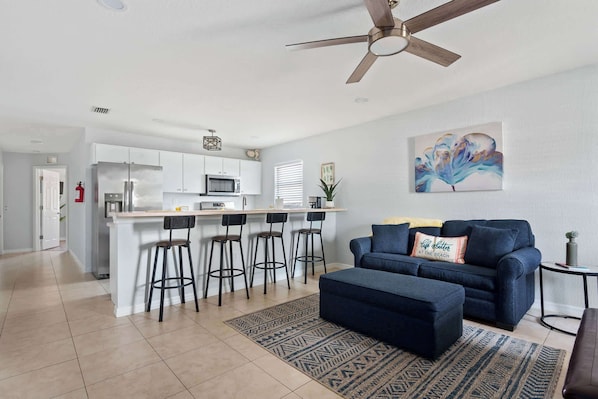 Open-concept living and kitchen area — a bright and welcoming space perfect for relaxing and enjoying meals together.