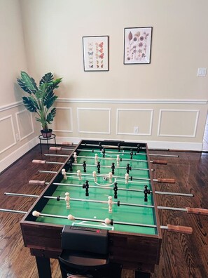 Game room with 13-in1 game table