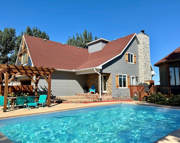 This spacious pool area is perfect for both relaxation and fun. 