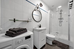 Bathroom with Shower and Washing Machine | Book Now with RENTUJEMY.COM