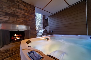 Soak the views of the lake and get cozy at your brand new 7-seat hot tub and wood burning fireplace