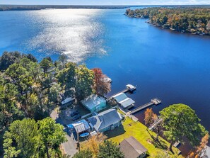 Aerial view of property and lake