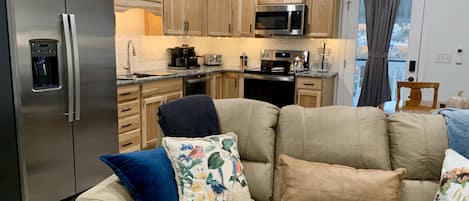 open floor plan allows guests ability to cook and watch TV