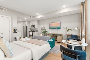 Our studio unit features a stylish, thoughtfully designed bedroom with a comfortable bed for restful nights, along with a sofa bed for extra guests. It also offers a dedicated workspace desk, ideal for productivity, and a TV for relaxing evenings, perfect