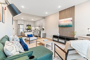 Modern Spacious Living area with access to Kitchen.