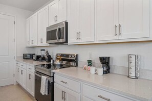 - Fully equipped kitchen with modern appliances and sleek finishes - Enjoy plenty of counter space and all the essentials for a home-cooked meal - Perfect for families or groups who love gathering around food and conversation