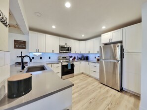 Newly remodeled kitchen featuring modern design and stainless steel appliances for all your cooking needs