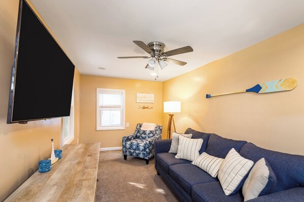 Unwind after a long day by enjoying a movie on the 65" screen, or use the pull out couch as an extra bed.