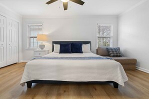 King Suite #2: The upstairs king suite offers a spacious retreat with a large 55" TV, a cozy sitting area, and roomy closets for all your storage needs. It's the perfect place to relax and unwind in comfort.