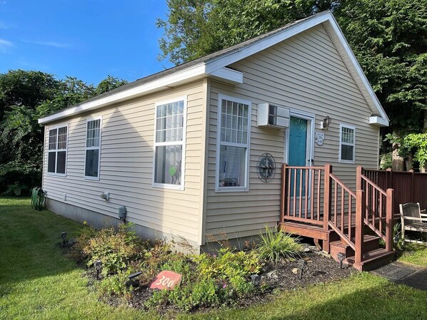 Stairs lead to Wrap around deck that faces the woods. What a sweet Retreat!