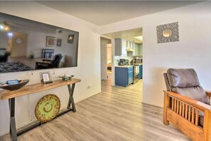 Living room with Smart TV, and ample seating