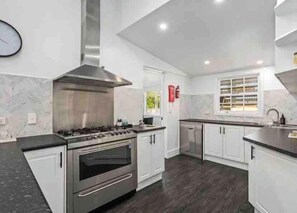 Commercial Size Gas Cooktop and oven with Dishwasher, Microwave and all cookware and table ware