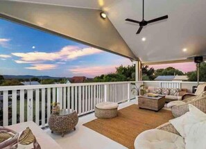 Spacious entertaining area with outdoor furniture and panoramic views of the D'Agular ranges. Gas Heater for winter time and ceiling fan and breezes in summer