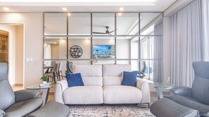 The living room with its mirrored wall.
