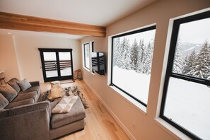 Cozy living room with wonderful picture windows of the mountains
