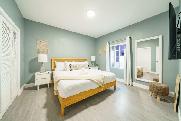 Bedroom with wide mirror