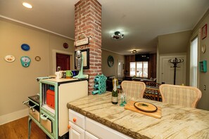 concrete countertops with can lights/night lights above the with bar 4 bar stool