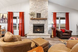 Stylish living room, complete with a sleek fireplace for that perfect cozy touch.