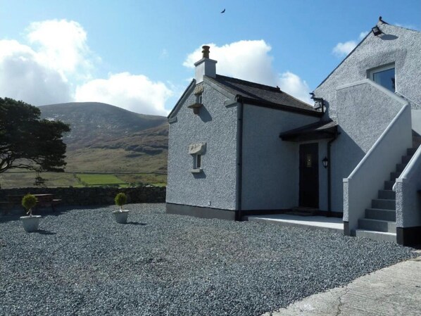 Cottage entrance and parking.