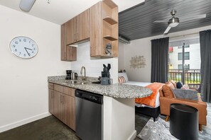 Craft tasty dishes in this contemporary kitchen with all the necessary amenities.