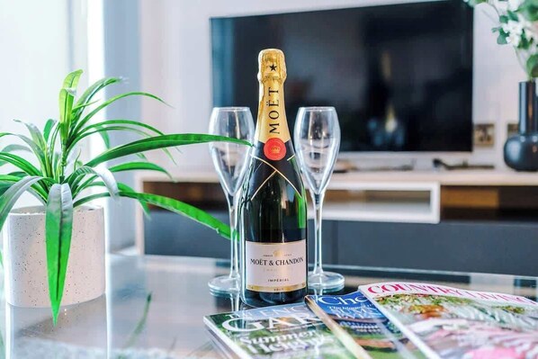 The open-plan living room, dining area and kitchen benefit from a comfortable sofa and 40-inch SMART TV.