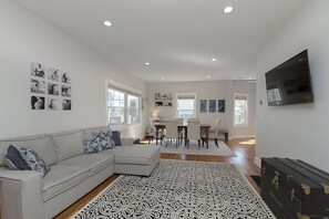 Living Room with Smart TV & Hardwood Floors