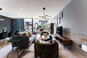 Stylish open-concept living and dining space, showcasing modern decor and a cozy atmosphere for group gatherings.