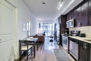 Spacious and cozy living room with comfortable seating and a Smart TV for your entertainment.