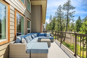 Private deck with a BBQ that overlooks the sports court.