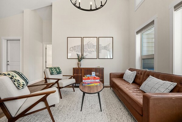 Beautifully designed living room on the main floor with cozy seating and plenty of natural lighting.