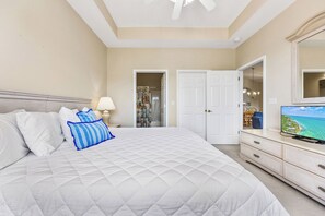 A tranquil primary bedroom with ensuite bathroom and tub/shower combo. 