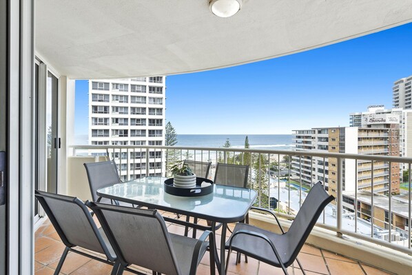 Enjoy your morning coffee in this spacious balcony overlooking the ocean/city
