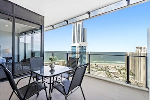 Enjoy your morning coffee in our spacious balcony overlooking the ocean/city