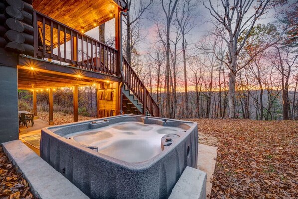 Relax and unwind in the soothing warmth of our outdoor hot tub—cheers to good vibes and great company!