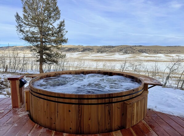 Beautiful cedar hot tub with amazing views, sunrises, and privacy