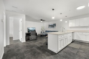 Large kitchen island open to living room. Excellent for friends and family.