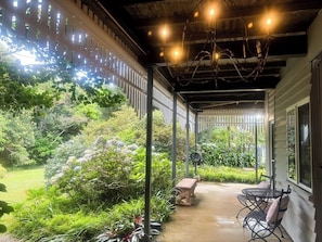Terrace with chandelier flowing onto the garden