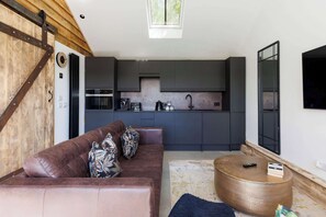 The main living space cleverly combines the kitchen with living and dining.