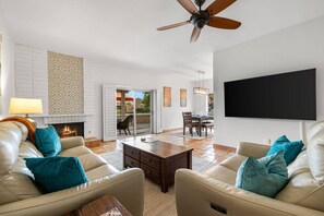 Cozy Living Room with Smart TV & Fireplace