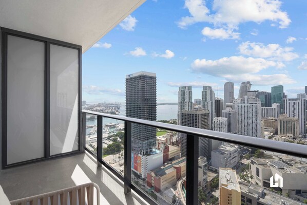 Open the floor-to-ceiling glass doors and step out onto your private balcony