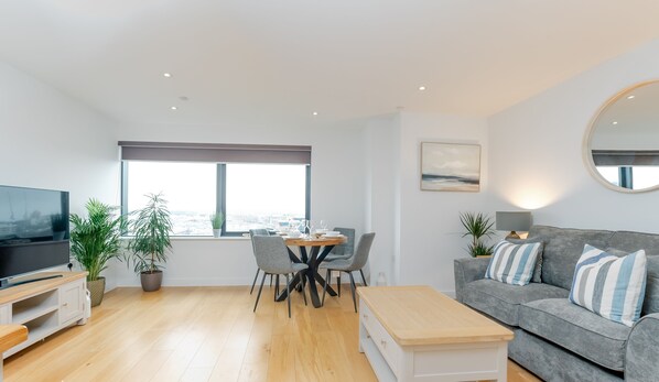 The layout for this one bedroom apartment is cohesive & welcoming