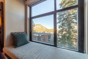 Window nook with futon overlooking the forest and mountains.
