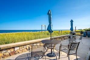Sip morning coffee or dine alfresco on the shared seaside patio