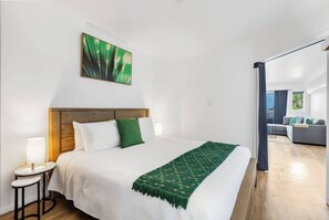 Unwind in the cosy bedroom, styled with natural tones and a plush king-size bed for a restful night’s sleep.