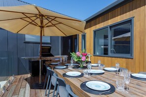 Enjoy a BBQ meal at the 12 seater outdoor table
