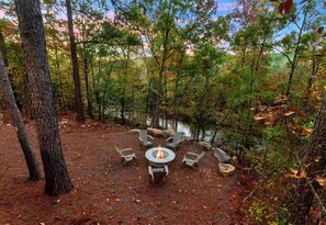 Enjoy evenings under the stars around the cozy fire pit, perfect for storytelling, s'mores, and soaking up the forest serenity.