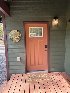 Porch entry door with key code pad.