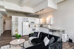 Spacious open-concept area featuring a modern furnishings, and a stylish entertainment setup—ideal for gatherings and relaxation.